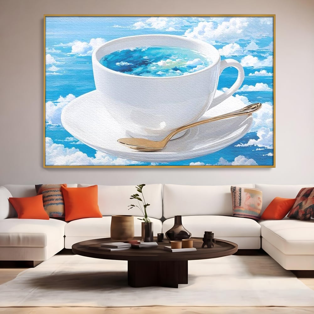 Tablou canvas cu tablou canvas cu ceasca de cafea si cer senin, in rama de aluminiu auriu, pe perete intr-un living